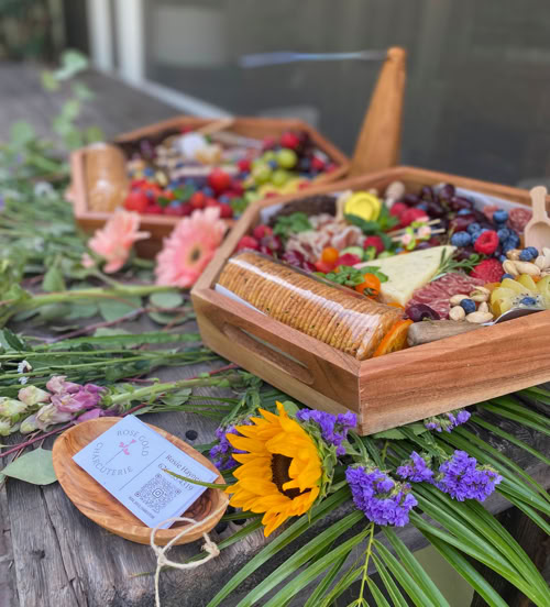 Hexagon-shaped charcuterie board loaded with premium cheeses, meats, fruits, crackers, and honey—designed for parties and celebrations in Southern California.