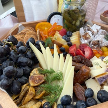 A Charcuterie Board with Cheese and Fruits