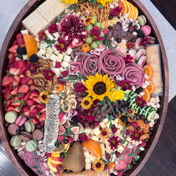 A Charcuterie Board with Cheese and Fruits