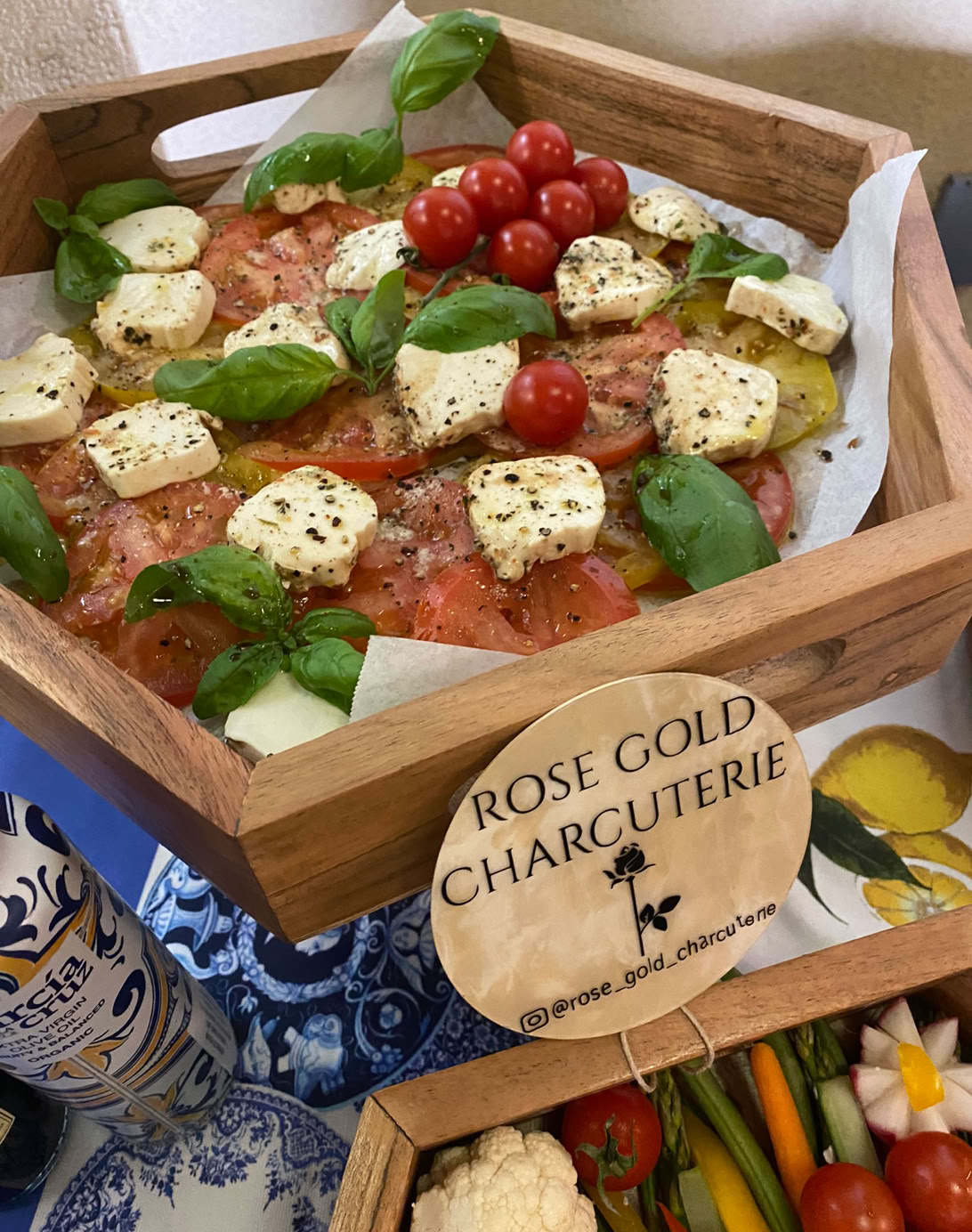 Fresh caprese-style appetizer box with tomatoes, mozzarella, basil, and cherry tomatoes by Rose Gold Charcuterie, San Dimas charcuterie catering service.
